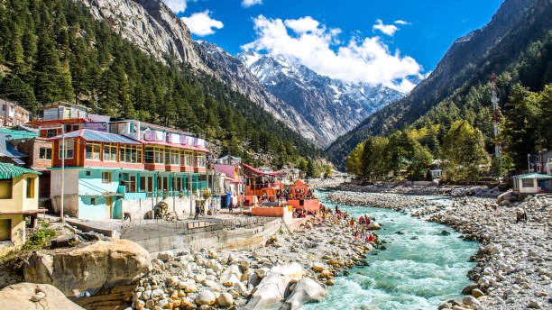 Scenic view of the Bhagirathi River flowing through Gangotri town surrounded by Himalayan mountains