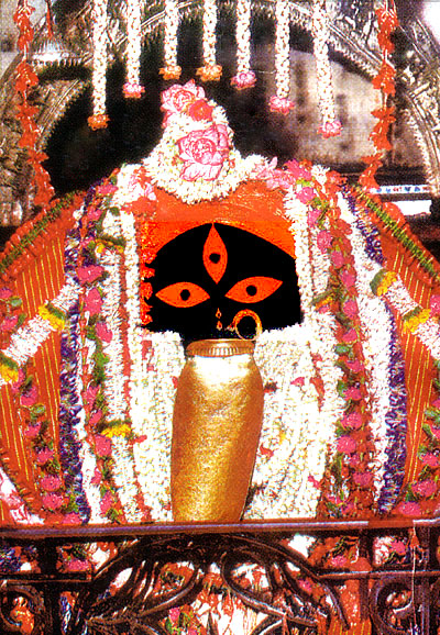 Sacred idol of Goddess Kali at Kalighat Temple Kolkata adorned with flowers and traditional decorations