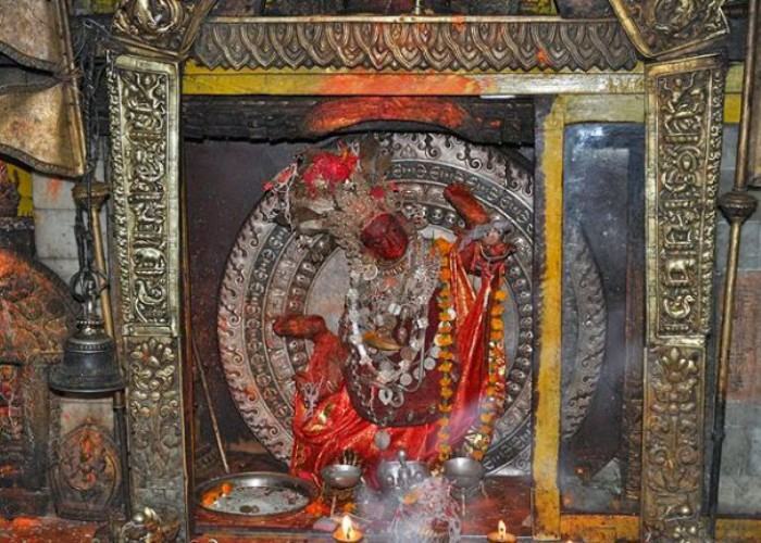 Guhyeshwari Shaktipeeth sanctum with sacred yoni shrine and silver kalasha in Kathmandu Nepal