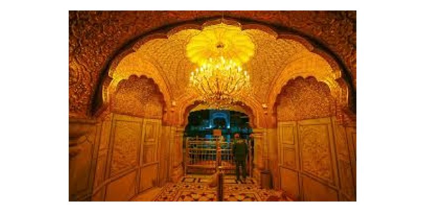 Interior golden architecture inside the Golden Temple Harmandir Sahib in Amritsar with intricate carvings and chandelier lighting