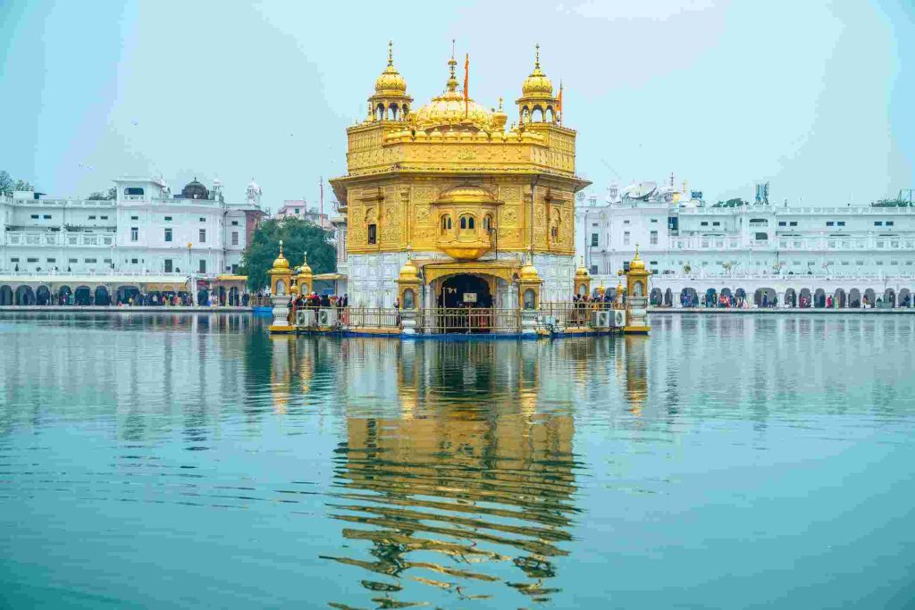 Golden Temple Harmandir Sahib reflecting in the Amrit Sarovar water in Amritsar Punjab India