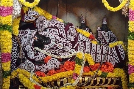 Lord Ranganatha Swamy reclining idol in Ananta Shayana posture at Ranganatha Temple Nellore decorated with flowers