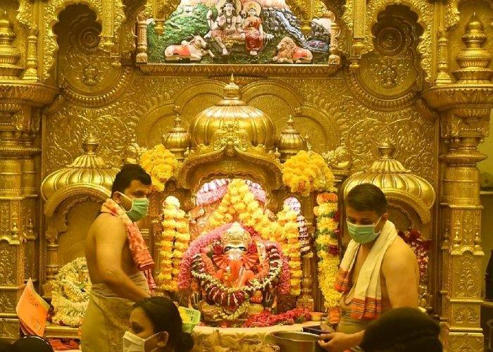 Priests performing puja at Siddhivinayak Temple Mumbai