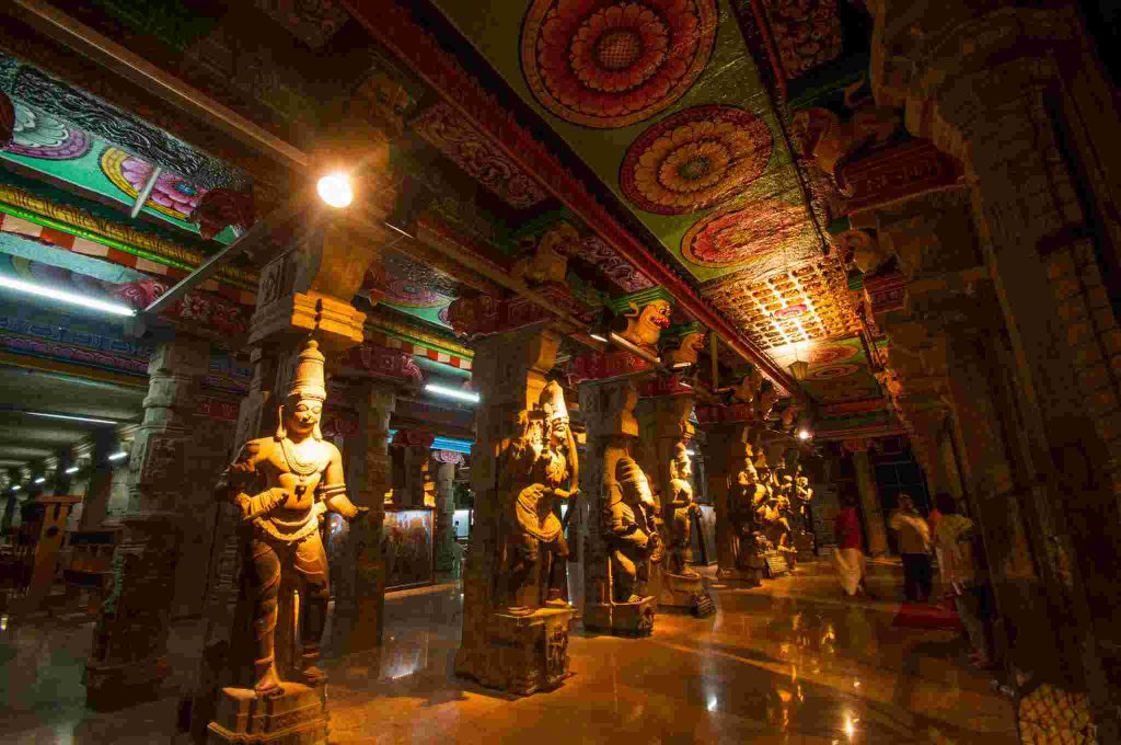 Intricate sculptures and pillars inside Meenakshi Amman Temple Madurai interior hall