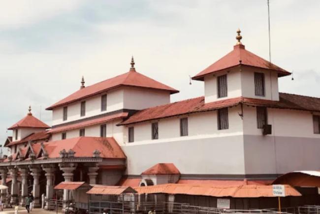 Exterior view of Dharmasthala Manjunatha Temple showcasing traditional Karnataka architecture