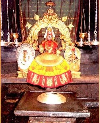 Goddess Mookambika idol inside Kollur temple sanctum with traditional decorations and deepam
