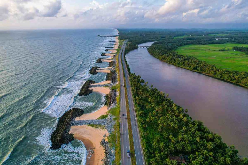 Maravanthe Beach highway with Arabian Sea on one side and river on the other