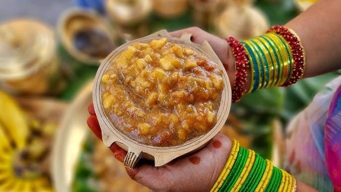 Devotee holding famous Palani Panchamirtham prasadam at Palani Murugan Temple.